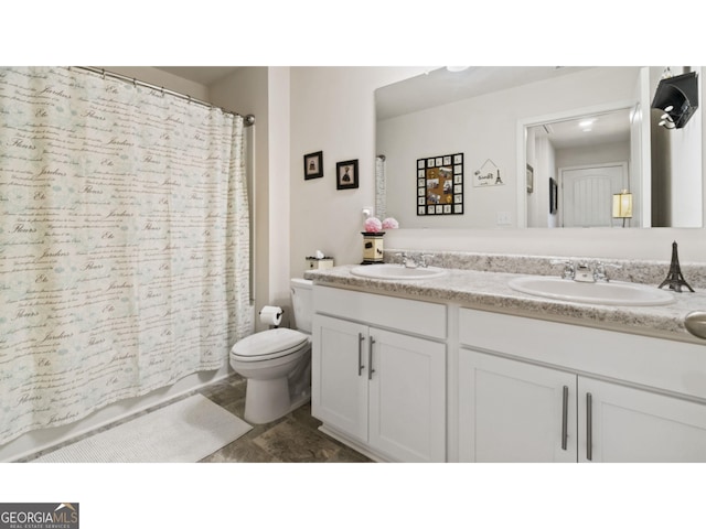 full bathroom with double vanity, shower / bath combination with curtain, toilet, and a sink