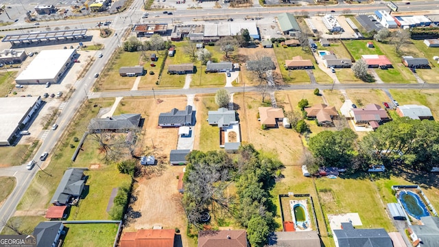 birds eye view of property with a residential view