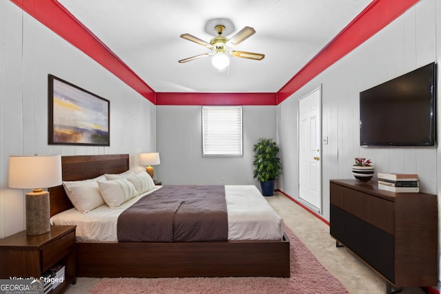 bedroom featuring light colored carpet and ceiling fan