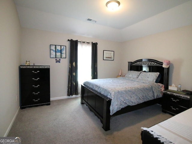 bedroom featuring baseboards, visible vents, and light carpet