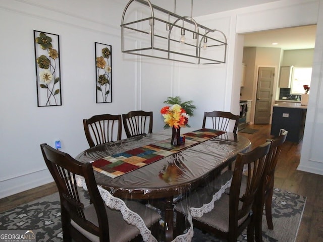 dining area with dark wood-style floors