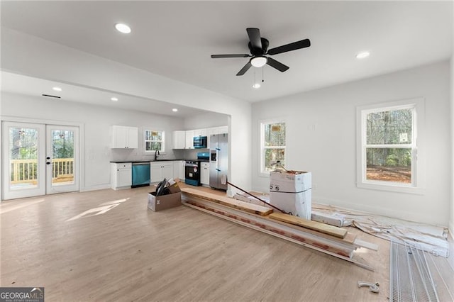 living room featuring recessed lighting, french doors, light wood-style floors, and a ceiling fan