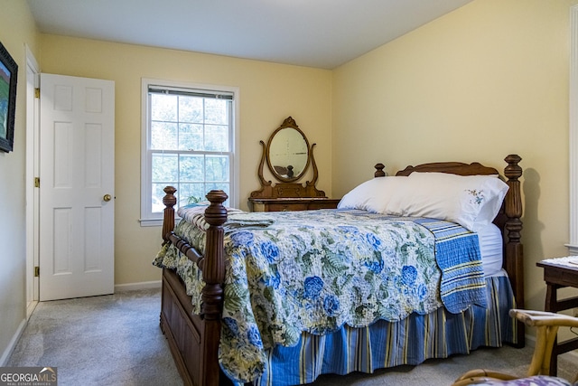 bedroom with baseboards and carpet flooring