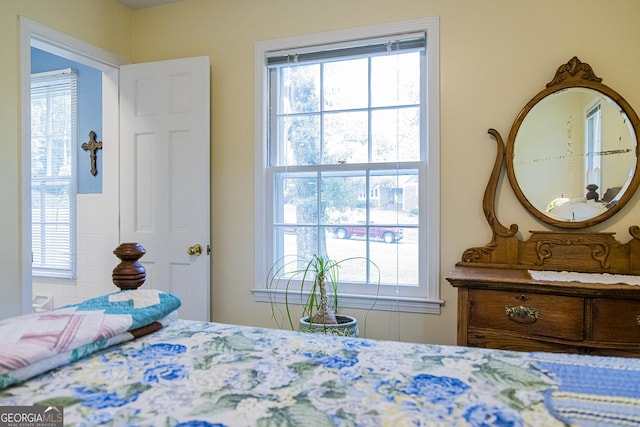 bedroom with multiple windows