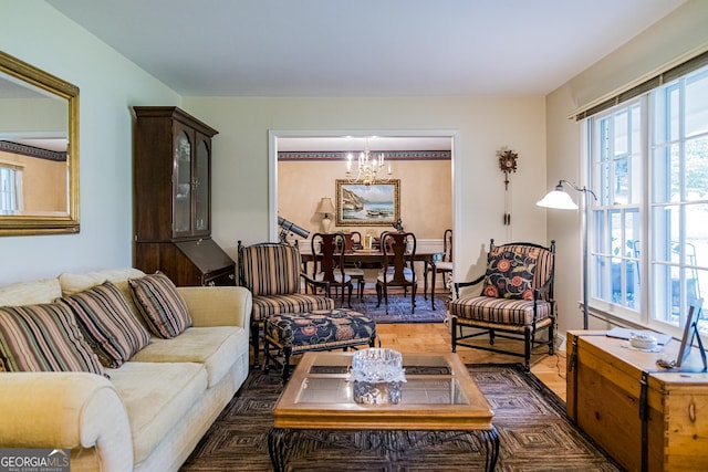 living area featuring a chandelier and wood finished floors