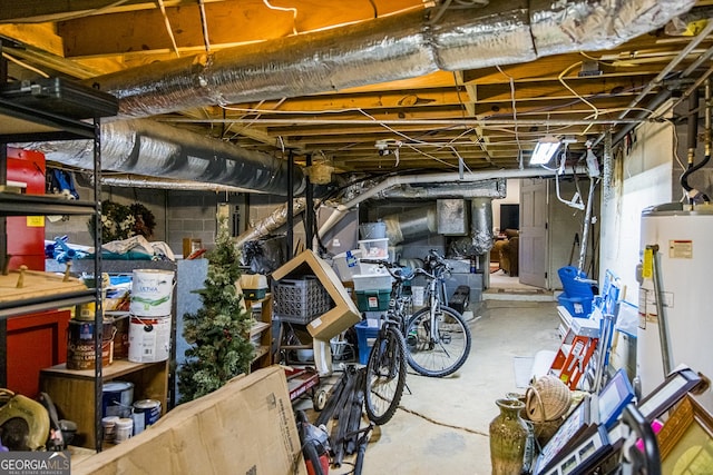 unfinished basement featuring water heater