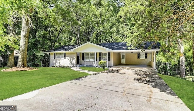 single story home with a front lawn, a carport, and aphalt driveway