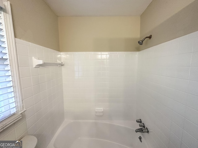 bathroom with toilet and shower / bath combination