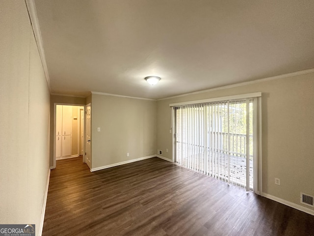 unfurnished room with crown molding, baseboards, dark wood-style flooring, and visible vents