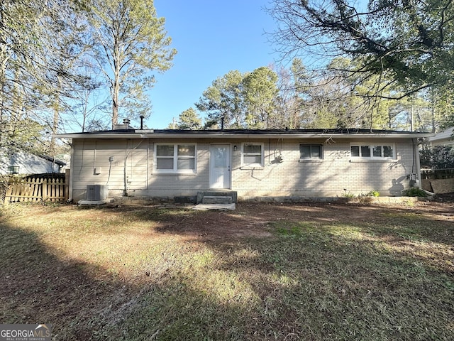 3395 Longleaf Dr, Decatur, GA 30032 - back of property featuring a yard, brick siding, central AC, and entry steps