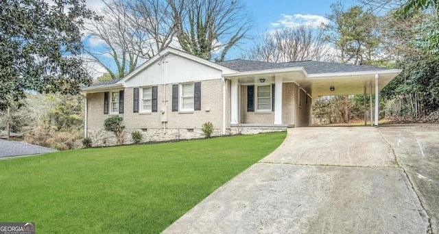 single story home with brick siding, a carport, a front yard, crawl space, and driveway