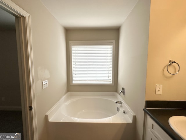 full bathroom with a bath and vanity