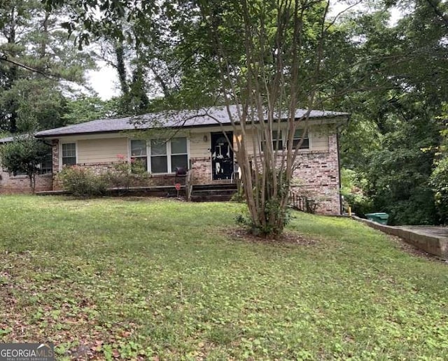 single story home with brick siding and a front lawn