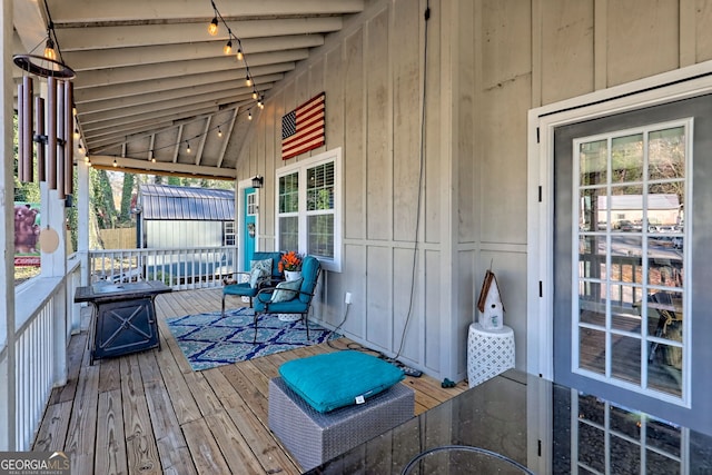 wooden terrace with a porch