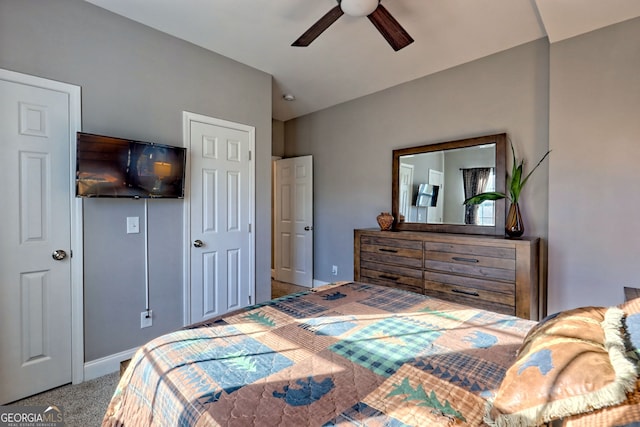 bedroom with baseboards, carpet floors, and ceiling fan