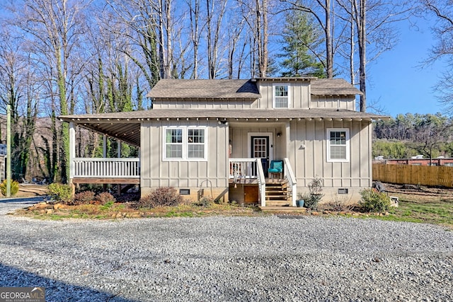 view of front of home featuring crawl space, board and batten siding, and a porch