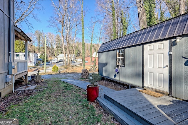 exterior space with an outbuilding and a storage unit