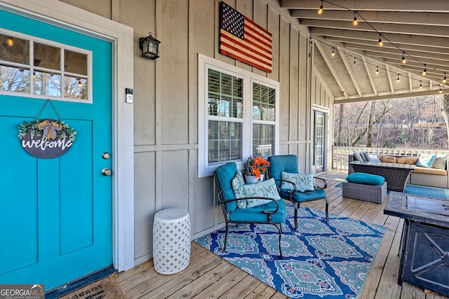 wooden deck featuring an outdoor hangout area