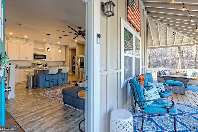 exterior space featuring a sink and outdoor lounge area