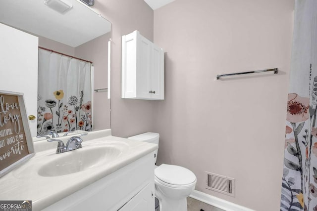 bathroom with visible vents, toilet, curtained shower, and vanity