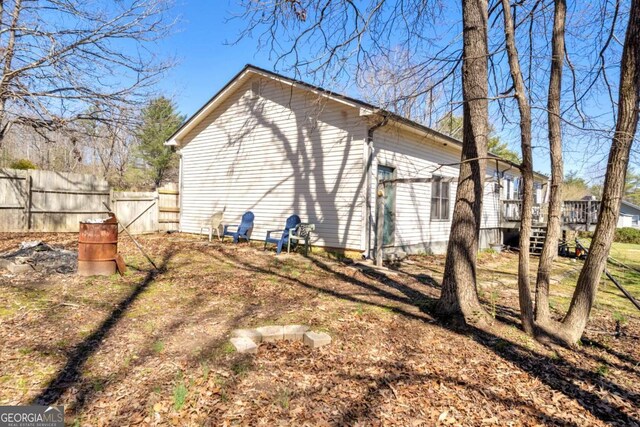 view of property exterior with fence