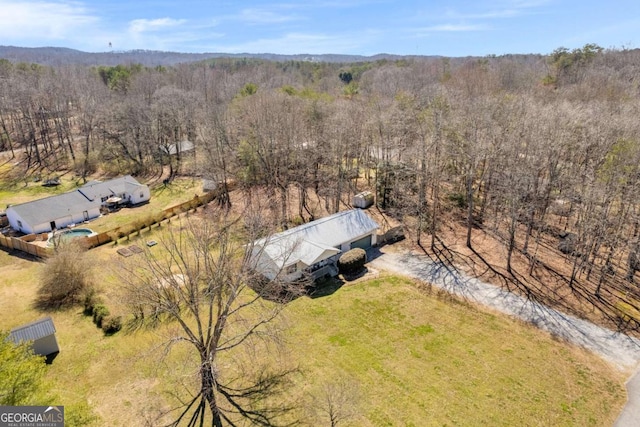 aerial view featuring a forest view