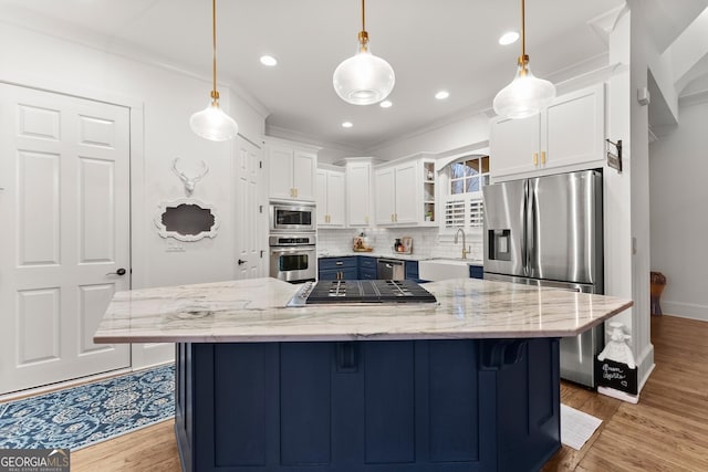 kitchen with a breakfast bar area, open shelves, stainless steel appliances, white cabinetry, and backsplash