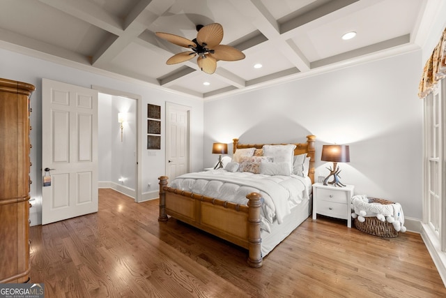 bedroom featuring beamed ceiling, recessed lighting, light wood-style floors, and coffered ceiling