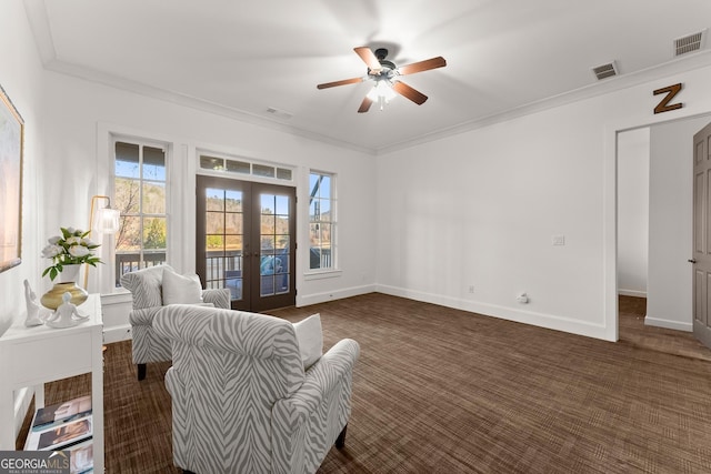 sitting room with baseboards, french doors, visible vents, and ornamental molding