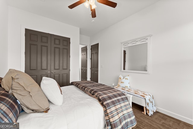 bedroom with wood finished floors, baseboards, a closet, and ceiling fan