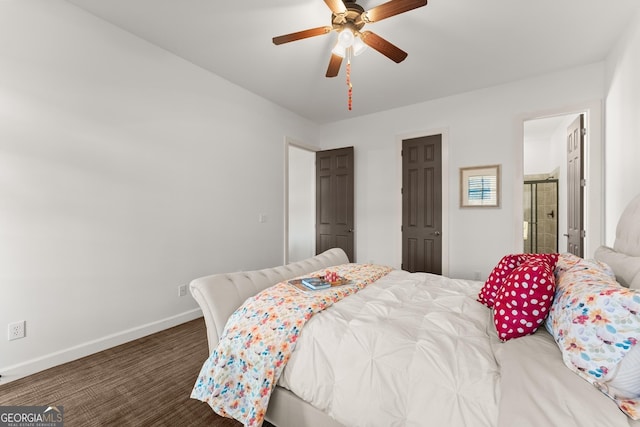 bedroom with baseboards, ensuite bathroom, and ceiling fan