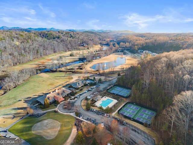 aerial view featuring a mountain view and a forest view