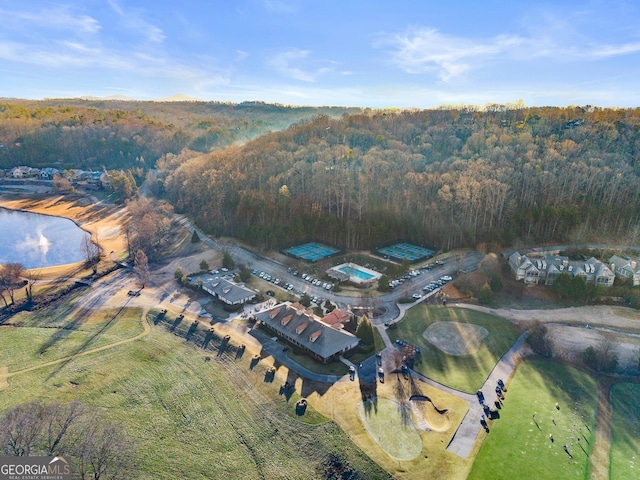 birds eye view of property with a wooded view