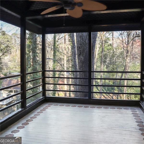 unfurnished sunroom with plenty of natural light