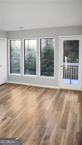 unfurnished sunroom with a wealth of natural light