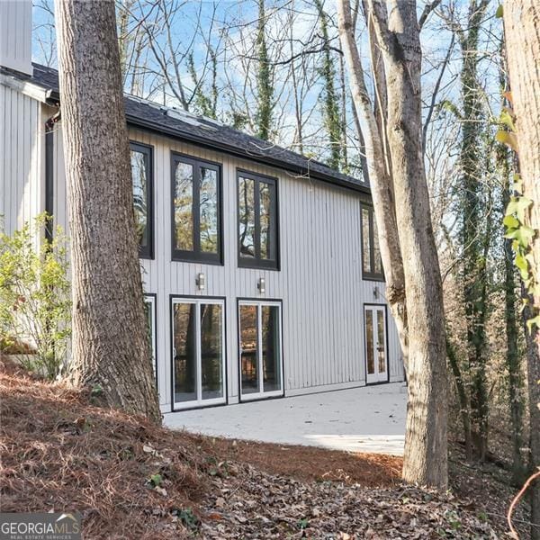 back of property with a patio and french doors