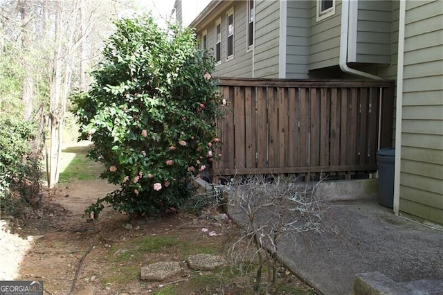 view of home's exterior featuring fence