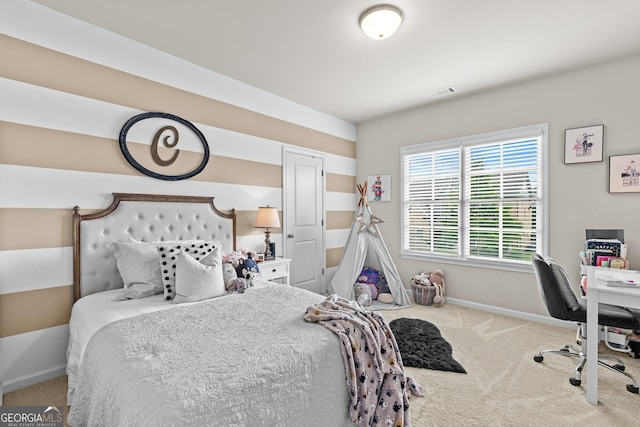 bedroom featuring visible vents, baseboards, and carpet