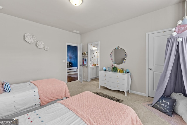 bedroom featuring baseboards and light carpet