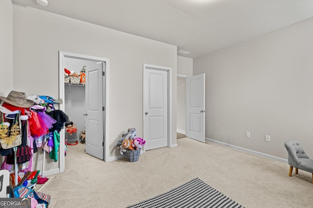 playroom with baseboards and carpet flooring