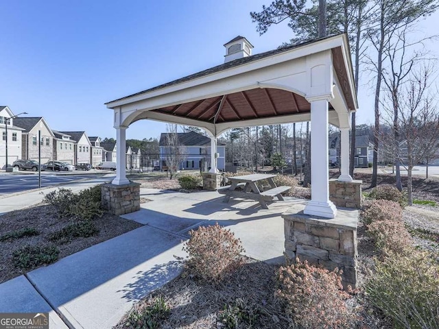 surrounding community featuring a gazebo and a residential view