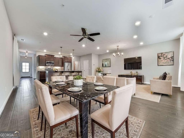 dining space featuring dark wood finished floors, recessed lighting, and baseboards