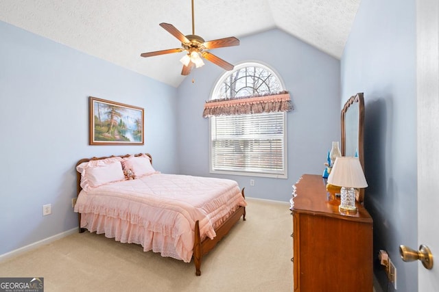 bedroom with baseboards, ceiling fan, vaulted ceiling, a textured ceiling, and light carpet