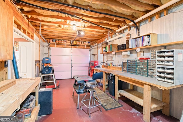 garage featuring a workshop area and a garage door opener