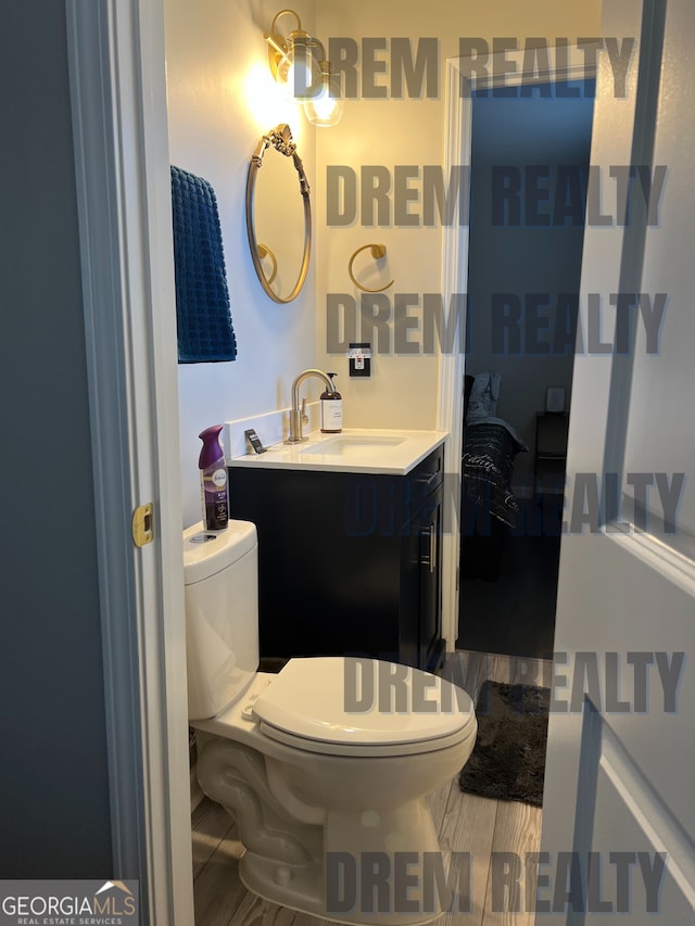4025 Gretna Dr, Decatur, GA 30035 - bathroom featuring vanity, ensuite bathroom, toilet, and wood finished floors