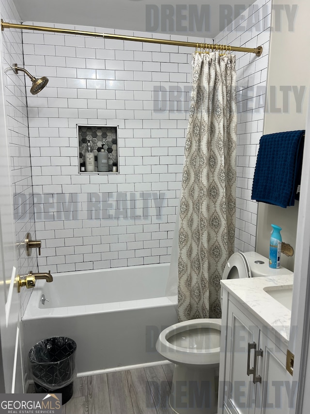4025 Gretna Dr, Decatur, GA 30035 - bathroom with toilet, shower / bathtub combination with curtain, vanity, and wood tiled floor