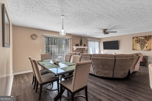 5545 Circlestone Ln, Stone Mountain, GA 30083 - dining space with a textured ceiling, baseboards, dark wood-style flooring, and ceiling fan
