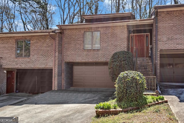 5545 Circlestone Ln, Stone Mountain, GA 30083 - view of front of house with a garage, brick siding, and driveway