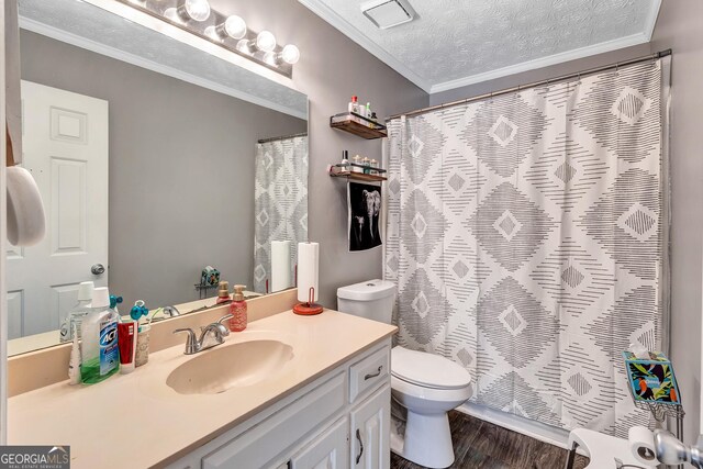 5545 Circlestone Ln, Stone Mountain, GA 30083 - bathroom with toilet, ornamental molding, a textured ceiling, wood finished floors, and vanity