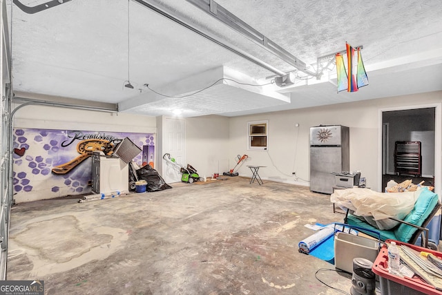 5545 Circlestone Ln, Stone Mountain, GA 30083 - garage featuring a garage door opener and freestanding refrigerator